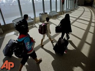 THANKSGIVING TRAVEL RUSH IS UNDER WAY ACROSS US