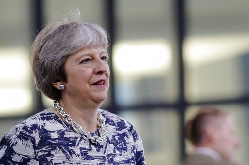 (AP Photo/Markus Schreiber). British Prime Minister Theresa May walks through the NATO headquarters prior to working session of a NATO a summit of heads of state and government in Brussels on Wednesday, July 11, 2018. (AP Photo/Markus Schreiber). British Prime Minister Theresa May walks through the NATO headquarters prior to working session of a NATO a summit of heads of state and government in Brussels on Wednesday, July 11, 2018.