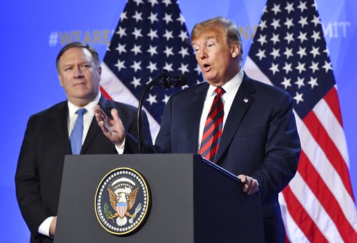(AP Photo/Geert Vanden Wijngaert). U.S. President Donald Trump is flanked by U.S. Secretary of State Mike Pompeo, left, as he speaks during a press conference after a summit of heads of state and government at NATO headquarters in Brussels, Belgium, Th... (AP Photo/Geert Vanden Wijngaert). U.S. President Donald Trump is flanked by U.S. Secretary of State Mike Pompeo, left, as he speaks during a press conference after a summit of heads of state and government at NATO headquarters in Brussels, Belgium, Th...
