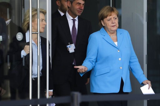(AP Photo/Markus Schreiber). German Chancellor Angela Merkel, right, arrives for a statement with Defense Minister Ursula von der Leyen, left, after a summit of heads of state and government at NATO headquarters in Brussels on Wednesday, July 11, 2018. (AP Photo/Markus Schreiber). German Chancellor Angela Merkel, right, arrives for a statement with Defense Minister Ursula von der Leyen, left, after a summit of heads of state and government at NATO headquarters in Brussels on Wednesday, July 11, 2018.