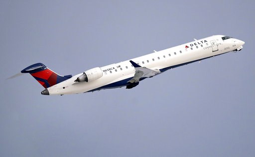 (AP Photo/Charles Krupa, File). FILE- In this Jan. 8, 2018, file photo, a Delta Air Lines Connection regional jet operated by GoJet Airlines takes off from Logan International Airport in Boston. Delta Air Lines reports earns on Thursday, July 12. (AP Photo/Charles Krupa, File). FILE- In this Jan. 8, 2018, file photo, a Delta Air Lines Connection regional jet operated by GoJet Airlines takes off from Logan International Airport in Boston. Delta Air Lines reports earns on Thursday, July 12.