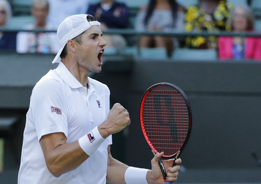 (AP Photo/Ben Curtis). John Isner of the United States celebrates winning the second set of his men's quarterfinals match against Canada's Milos Raonic, at the Wimbledon Tennis Championships, in London, Wednesday July 11, 2018. (AP Photo/Ben Curtis). John Isner of the United States celebrates winning the second set of his men's quarterfinals match against Canada's Milos Raonic, at the Wimbledon Tennis Championships, in London, Wednesday July 11, 2018.