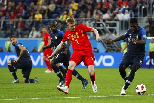 (AP Photo/Frank Augstein). Belgium's Kevin De Bruyne, center, and France's Samuel Umtiti challenge for the ball during the semifinal match between France and Belgium at the 2018 soccer World Cup in the St. Petersburg Stadium in, St. Petersburg, Russia,... (AP Photo/Frank Augstein). Belgium's Kevin De Bruyne, center, and France's Samuel Umtiti challenge for the ball during the semifinal match between France and Belgium at the 2018 soccer World Cup in the St. Petersburg Stadium in, St. Petersburg, Russia,...
