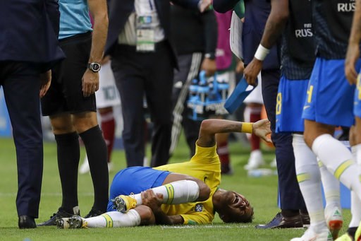 (AP Photo/Andre Penner). Brazil's Neymar lies on the ground during the round of 16 match between Brazil and Mexico at the 2018 soccer World Cup in the Samara Arena, in Samara, Russia, Monday, July 2, 2018. (AP Photo/Andre Penner). Brazil's Neymar lies on the ground during the round of 16 match between Brazil and Mexico at the 2018 soccer World Cup in the Samara Arena, in Samara, Russia, Monday, July 2, 2018.