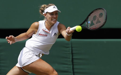 (AP Photo/Kirsty Wigglesworth). Germany's Angelique Kerber returns the ball to Latvia's Jelena Ostapenko during their women's singles semifinals match at the Wimbledon Tennis Championships, in London, Thursday July 12, 2018. (AP Photo/Kirsty Wigglesworth). Germany's Angelique Kerber returns the ball to Latvia's Jelena Ostapenko during their women's singles semifinals match at the Wimbledon Tennis Championships, in London, Thursday July 12, 2018.
