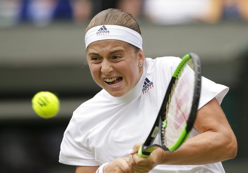 (AP Photo/Tim Ireland). Jelena Ostapenko of Latvia returns the ball to Dominika Cibulkova of Slovakia during their women's quarterfinal match at the Wimbledon Tennis Championships in London, Tuesday July 10, 2018. (AP Photo/Tim Ireland). Jelena Ostapenko of Latvia returns the ball to Dominika Cibulkova of Slovakia during their women's quarterfinal match at the Wimbledon Tennis Championships in London, Tuesday July 10, 2018.