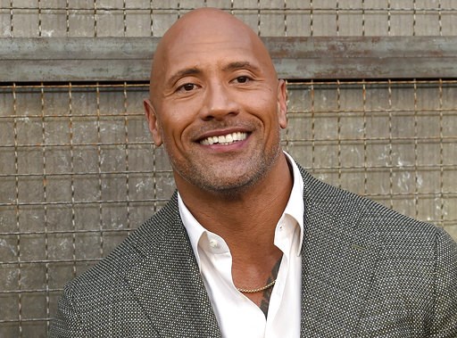 (Photo by Chris Pizzello/Invision/AP, File). FILE - In this April 4, 2018 file photo, Dwayne Johnson arrives at the world premiere of "Rampage" at the Microsoft Theater in Los Angeles. Johnson, who plays an amputee in the action movie "Skyscraper" said... (Photo by Chris Pizzello/Invision/AP, File). FILE - In this April 4, 2018 file photo, Dwayne Johnson arrives at the world premiere of "Rampage" at the Microsoft Theater in Los Angeles. Johnson, who plays an amputee in the action movie "Skyscraper" said...