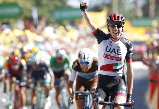 (AP Photo/Christophe Ena ). Ireland's Daniel Martin celebrates as he crosses the finish line to win the sixth stage of the Tour de France cycling race over 181 kilometers (112.5 miles) with start in Brest and finish in Mur-de-Bretagne Guerledan, France... (AP Photo/Christophe Ena ). Ireland's Daniel Martin celebrates as he crosses the finish line to win the sixth stage of the Tour de France cycling race over 181 kilometers (112.5 miles) with start in Brest and finish in Mur-de-Bretagne Guerledan, France...