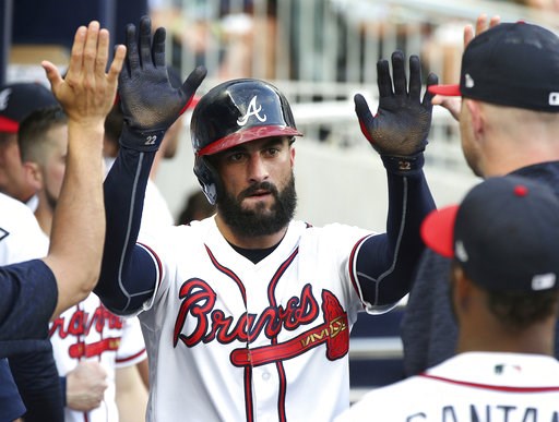 (Curtis Compton/Atlanta Journal-Constitution via AP). Atlanta Braves' Nick Markakis is congratulated after scoring against the Toronto Blue Jays during the second inning of a baseball game Wednesday, July 11, 2018, in Atlanta. (Curtis Compton/Atlanta Journal-Constitution via AP). Atlanta Braves' Nick Markakis is congratulated after scoring against the Toronto Blue Jays during the second inning of a baseball game Wednesday, July 11, 2018, in Atlanta.