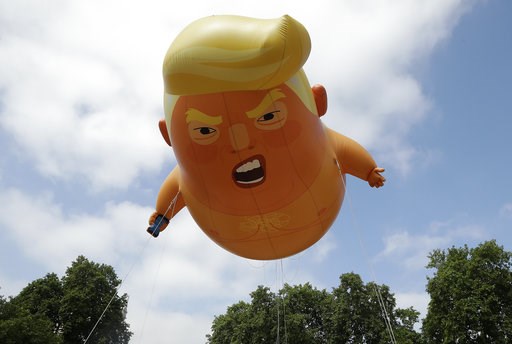 (AP Photo/Matt Dunham). A six-meter high cartoon baby blimp of U.S. President Donald Trump is flown as a protest against his visit, in Parliament Square in London, England, Friday, July 13, 2018. Trump is making his first trip to Britain as president a... (AP Photo/Matt Dunham). A six-meter high cartoon baby blimp of U.S. President Donald Trump is flown as a protest against his visit, in Parliament Square in London, England, Friday, July 13, 2018. Trump is making his first trip to Britain as president a...