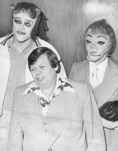 (Pittsburgh Post-Gazette via AP). This 1979 photo shows transgender man Dante "Tex" Gill, flanked by masked Frank Cocchiara, left, and Donna Potts while leaving the Public Safety Building in Pittsburgh, Pa. Actress Scarlett Johansson has pulled out of... (Pittsburgh Post-Gazette via AP). This 1979 photo shows transgender man Dante "Tex" Gill, flanked by masked Frank Cocchiara, left, and Donna Potts while leaving the Public Safety Building in Pittsburgh, Pa. Actress Scarlett Johansson has pulled out of...