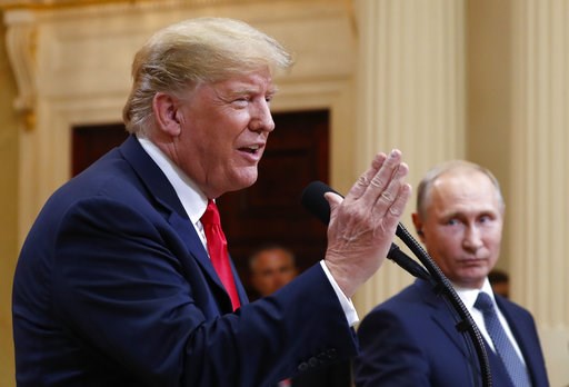The Latest: Trump says he misspoke on Russia, US election
