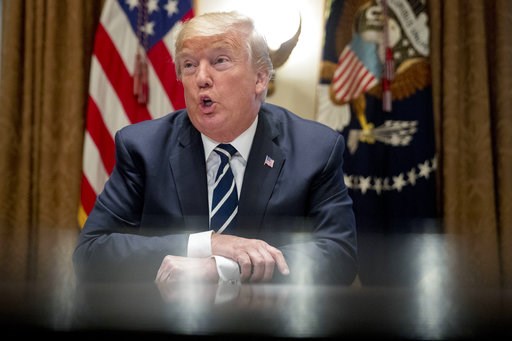 Trump talks tougher, now says he warned Putin on meddling