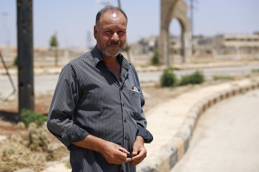 Under Assad's grip, uneasy co-existence with former rebels