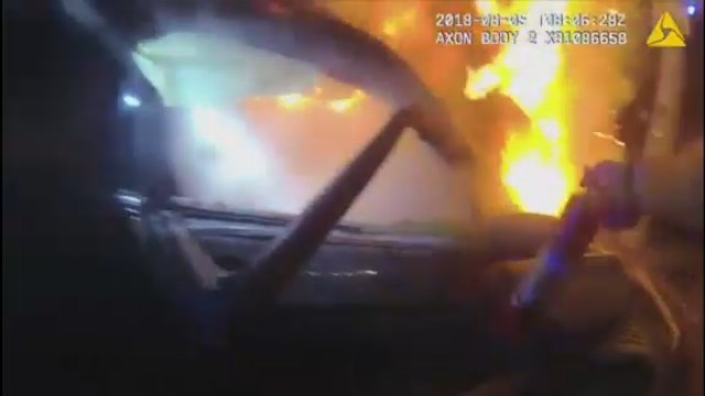 Atlanta police rescue trapped passenger from burning car