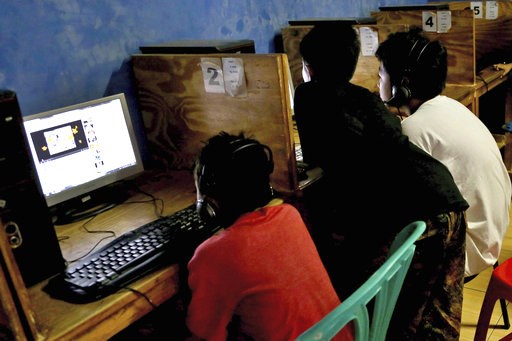 (AP Photo/Tatan Syuflana). FILE - In this Monday, Dec. 23, 2013 file photo, youths look at computer screens at an Internet cafe in Jakarta, Indonesia. The tech industry's use of persuasive psychological techniques to keep kids glued to their screens is... (AP Photo/Tatan Syuflana). FILE - In this Monday, Dec. 23, 2013 file photo, youths look at computer screens at an Internet cafe in Jakarta, Indonesia. The tech industry's use of persuasive psychological techniques to keep kids glued to their screens is...