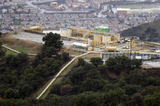 (AP Photo/Jae C. Hong, File). FILE - This Jan. 12, 2017 file photo shows gas gathering plant on a hilltop at the Southern California Gas Company's Aliso Canyon storage facility near the Porter Ranch neighborhood of Los Angeles. A tentative settlement h... (AP Photo/Jae C. Hong, File). FILE - This Jan. 12, 2017 file photo shows gas gathering plant on a hilltop at the Southern California Gas Company's Aliso Canyon storage facility near the Porter Ranch neighborhood of Los Angeles. A tentative settlement h...