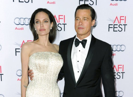 (Photo by Richard Shotwell/Invision/AP, File). FILE - In this Nov. 5, 2015 file photo, Angelina Jolie, left, and Brad Pitt arrive at the 2015 AFI Fest opening night premiere of "By The Sea" in Los Angeles. Jolie Pitt says she wants her divorce from Bra... (Photo by Richard Shotwell/Invision/AP, File). FILE - In this Nov. 5, 2015 file photo, Angelina Jolie, left, and Brad Pitt arrive at the 2015 AFI Fest opening night premiere of "By The Sea" in Los Angeles. Jolie Pitt says she wants her divorce from Bra...
