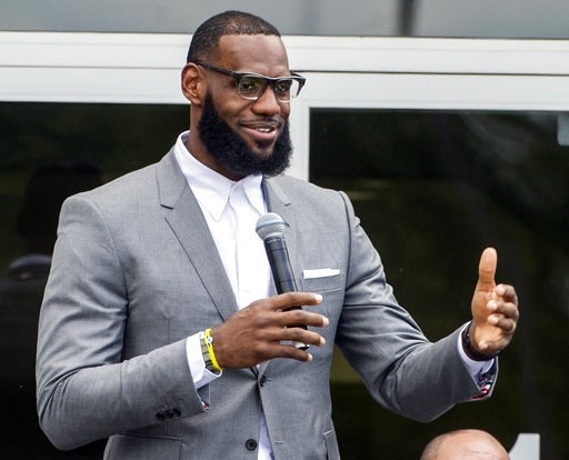 (AP Photo/Phil Long, File). FILE - In this Monday, July 30, 2018, file photo, LeBron James speaks at the opening ceremony for the I Promise School in Akron, Ohio. James has yet to play a minute for the Los Angeles Lakers, yet the NBA superstar is churn... (AP Photo/Phil Long, File). FILE - In this Monday, July 30, 2018, file photo, LeBron James speaks at the opening ceremony for the I Promise School in Akron, Ohio. James has yet to play a minute for the Los Angeles Lakers, yet the NBA superstar is churn...