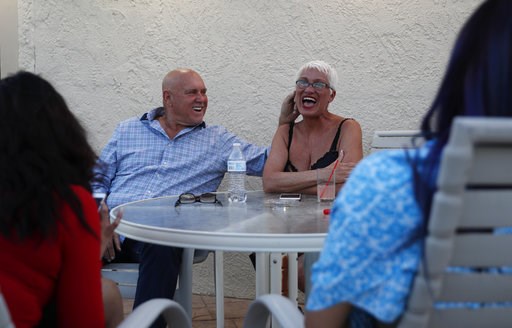(AP Photo/John Locher, File). FILE - In this April 27, 2018, file photo, owner Dennis Hof, left, jokes with madam Sonja Bandolik at the Love Ranch brothel in Crystal, Nev. County officials in Nevada have yanked a brothel license from the state's most f... (AP Photo/John Locher, File). FILE - In this April 27, 2018, file photo, owner Dennis Hof, left, jokes with madam Sonja Bandolik at the Love Ranch brothel in Crystal, Nev. County officials in Nevada have yanked a brothel license from the state's most f...