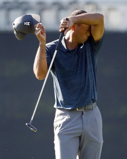 (AP Photo/Jeff Roberson). Tiger Woods wipes off his face on the10th green during the first round of the PGA Championship golf tournament at Bellerive Country Club, Thursday, Aug. 9, 2018, in St. Louis. (AP Photo/Jeff Roberson). Tiger Woods wipes off his face on the10th green during the first round of the PGA Championship golf tournament at Bellerive Country Club, Thursday, Aug. 9, 2018, in St. Louis.