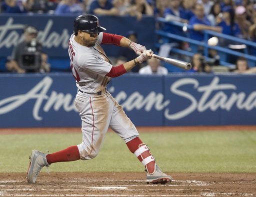 (Fred Thornhill/The Canadian Press via AP). Boston Red Sox's Mookie Betts hits a home run against the Toronto Blue Jays during the ninth inning of a baseball game Thursday, Aug. 9, 2018, in Toronto. (Fred Thornhill/The Canadian Press via AP). Boston Red Sox's Mookie Betts hits a home run against the Toronto Blue Jays during the ninth inning of a baseball game Thursday, Aug. 9, 2018, in Toronto.