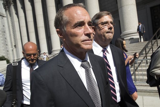 (AP Photo/Mary Altaffer). Republican U.S. Rep. Christopher Collins, center, leaves federal court, Wednesday, Aug. 8, 2018, in New York. Rep. Collins of western New York state has been indicted on charges that he used inside information about a biotechn... (AP Photo/Mary Altaffer). Republican U.S. Rep. Christopher Collins, center, leaves federal court, Wednesday, Aug. 8, 2018, in New York. Rep. Collins of western New York state has been indicted on charges that he used inside information about a biotechn...