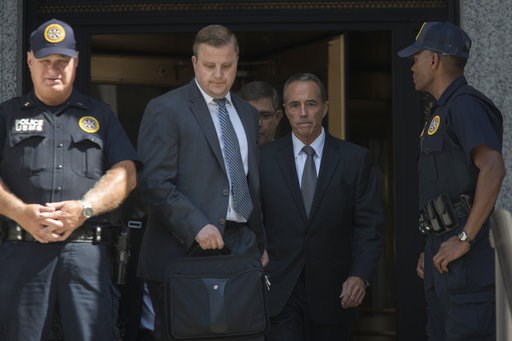 (AP Photo/Mary Altaffer). Republican U.S. Rep. Christopher Collins, center, leaves federal court, Wednesday, Aug. 8, 2018, in New York. Rep. Collins of western New York state has been indicted on charges that he used inside information about a biotechn... (AP Photo/Mary Altaffer). Republican U.S. Rep. Christopher Collins, center, leaves federal court, Wednesday, Aug. 8, 2018, in New York. Rep. Collins of western New York state has been indicted on charges that he used inside information about a biotechn...