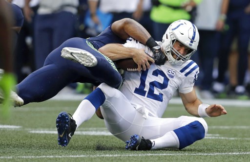 (AP Photo/Stephen Brashear). Indianapolis Colts quarterback Andrew Luck (12) is tackled by Seattle Seahawks linebacker Bobby Wagner during the first half of an NFL football preseason game, Thursday, Aug. 9, 2018, in Seattle. (AP Photo/Stephen Brashear). Indianapolis Colts quarterback Andrew Luck (12) is tackled by Seattle Seahawks linebacker Bobby Wagner during the first half of an NFL football preseason game, Thursday, Aug. 9, 2018, in Seattle.