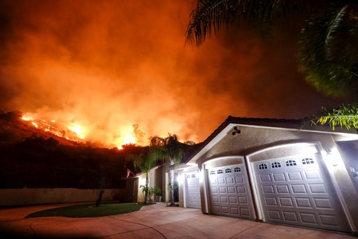 (AP Photo/Ringo H.W. Chiu). The Holy Fire burns near homes in the Cleveland National Forest in Lake Elsinore, Calif., Thursday, Aug. 9, 2018. (AP Photo/Ringo H.W. Chiu). The Holy Fire burns near homes in the Cleveland National Forest in Lake Elsinore, Calif., Thursday, Aug. 9, 2018.