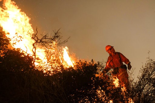 (AP Photo/Ringo H.W. Chiu). A firefighter sets a backburn to fight the Holy Fire as it burns in the Cleveland National Forest along a hillside at Temescal Valley in Corona, Calif., Thursday, Aug. 9, 2018. Firefighters fought a desperate battle to stop ... (AP Photo/Ringo H.W. Chiu). A firefighter sets a backburn to fight the Holy Fire as it burns in the Cleveland National Forest along a hillside at Temescal Valley in Corona, Calif., Thursday, Aug. 9, 2018. Firefighters fought a desperate battle to stop ...