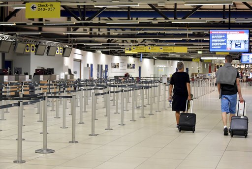 (Bernd Settnik/dpa via AP). Passenger walk through the empty departure hall of the Schoenefeld airport near Berlin Friday, Aug. 10, 2018 when several flights of Irish Ryanair airline had been cancelled due to a strike of pilots. (Bernd Settnik/dpa via AP). Passenger walk through the empty departure hall of the Schoenefeld airport near Berlin Friday, Aug. 10, 2018 when several flights of Irish Ryanair airline had been cancelled due to a strike of pilots.