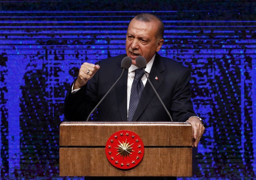 (AP Photo/Burhan Ozbilici). Turkey's President Recep Tayyip Erdogan announces plan of action for the first 100 days of his new presidency, in Ankara, Turkey, Friday, Aug. 3, 2018. (AP Photo/Burhan Ozbilici). Turkey's President Recep Tayyip Erdogan announces plan of action for the first 100 days of his new presidency, in Ankara, Turkey, Friday, Aug. 3, 2018.