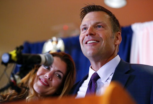 (Chris Neal/The Topeka Capital-Journal via AP). Kansas Republican gubernatorial candidate Kris Kobach and his wife Heather take the stage to thank their supporters and send them home for the night after problems with polls in Johnson County, Kan., dela... (Chris Neal/The Topeka Capital-Journal via AP). Kansas Republican gubernatorial candidate Kris Kobach and his wife Heather take the stage to thank their supporters and send them home for the night after problems with polls in Johnson County, Kan., dela...