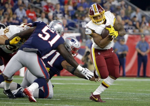 (AP Photo/Steven Senne). Washington Redskins running back Derrius Guice, right, evades New England Patriots linebacker Ja'Whaun Bentley (51) and defensive tackle Danny Shelton, center, during the first half of a preseason NFL football game, Thursday, A... (AP Photo/Steven Senne). Washington Redskins running back Derrius Guice, right, evades New England Patriots linebacker Ja'Whaun Bentley (51) and defensive tackle Danny Shelton, center, during the first half of a preseason NFL football game, Thursday, A...