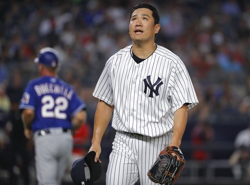 (AP Photo/Julie Jacobson). New York Yankees starting pitcher Masahiro Tanaka walks off the field at the end of the top of the fourth inning of a baseball game against the Texas Rangers, Friday, Aug. 10, 2018, in New York. (AP Photo/Julie Jacobson). New York Yankees starting pitcher Masahiro Tanaka walks off the field at the end of the top of the fourth inning of a baseball game against the Texas Rangers, Friday, Aug. 10, 2018, in New York.