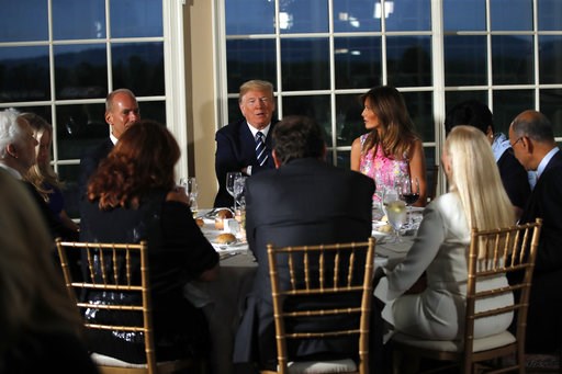 (AP Photo/Carolyn Kaster). President Donald Trump sits with first lady Melania Trump as he meets with business leaders, Tuesday, Aug. 7, 2018, at Trump National Golf Club in Bedminster, N.J. (AP Photo/Carolyn Kaster). President Donald Trump sits with first lady Melania Trump as he meets with business leaders, Tuesday, Aug. 7, 2018, at Trump National Golf Club in Bedminster, N.J.