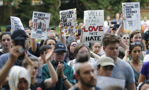 (AP Photo/Steve Helber). Demonstrators march on the campus of the University of Virginia in anticipation of the anniversary of last year's Unite the Right rally in Charlottesville, Va., Saturday, Aug. 11, 2018. (AP Photo/Steve Helber). Demonstrators march on the campus of the University of Virginia in anticipation of the anniversary of last year's Unite the Right rally in Charlottesville, Va., Saturday, Aug. 11, 2018.