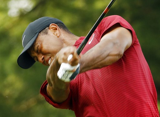 (AP Photo/Charlie Riedel). Tiger Woods hits from the 15th tee during the final round of the PGA Championship golf tournament at Bellerive Country Club, Sunday, Aug. 12, 2018, in St. Louis. (AP Photo/Charlie Riedel). Tiger Woods hits from the 15th tee during the final round of the PGA Championship golf tournament at Bellerive Country Club, Sunday, Aug. 12, 2018, in St. Louis.