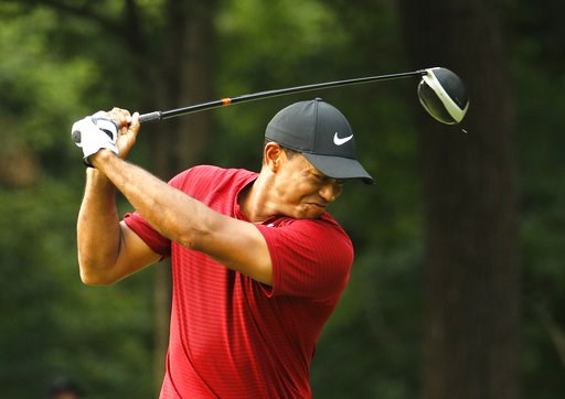 (AP Photo/Charlie Riedel). Tiger Woods reacts to his drive on the 17th hole during the final round of the PGA Championship golf tournament at Bellerive Country Club, Sunday, Aug. 12, 2018, in St. Louis. (AP Photo/Charlie Riedel). Tiger Woods reacts to his drive on the 17th hole during the final round of the PGA Championship golf tournament at Bellerive Country Club, Sunday, Aug. 12, 2018, in St. Louis.