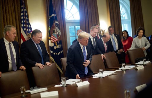 (AP Photo/Pablo Martinez Monsivais, File). In this July 18, 2018, file photo, President Donald Trump, center, takes his seat before the start of his meeting with members of his Cabinet in the Cabinet Room of the White House in Washington. Also taking t... (AP Photo/Pablo Martinez Monsivais, File). In this July 18, 2018, file photo, President Donald Trump, center, takes his seat before the start of his meeting with members of his Cabinet in the Cabinet Room of the White House in Washington. Also taking t...