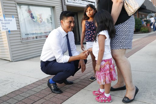 (AP Photo/John Minchillo). Hamilton County Clerk of Courts Aftab Pureval greets constituents and their children as he campaigns for his 1st House District challenge against veteran Republican Rep. Steve Chabot at a music festival, Friday, June 15, 2018... (AP Photo/John Minchillo). Hamilton County Clerk of Courts Aftab Pureval greets constituents and their children as he campaigns for his 1st House District challenge against veteran Republican Rep. Steve Chabot at a music festival, Friday, June 15, 2018...