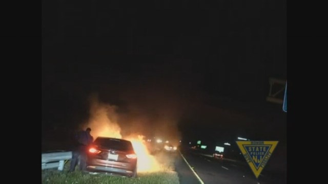 Video: State troopers pull unconscious man from burning car
