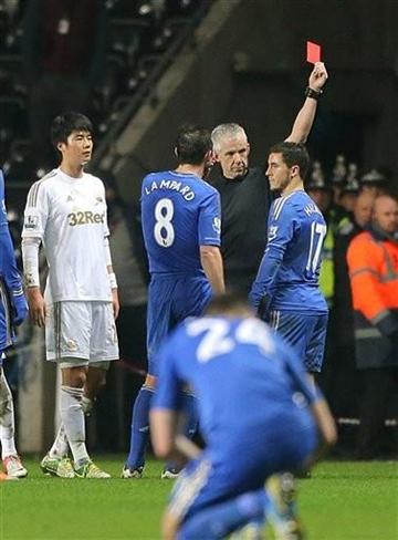 AP Photo/PA, Nick Potts). Chelsea's Eden Hazard, right, receives a 