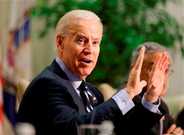 Steve Helber). Vice President Joe Biden gestures during a round table