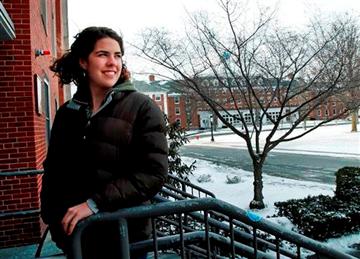 (AP Photo/Elise Amendola). Freshman Lydia Collins, 19, looks out from her dorm building at Tufts University in Medford, Mass., Thursday, March 13, 2014.