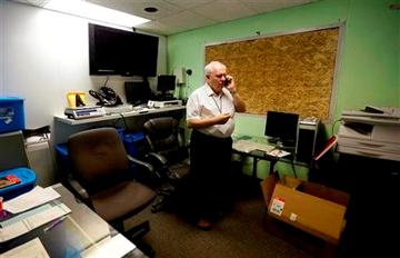 (AP Photo/Ted S. Warren). In this June 25, 2014, photo, Bob Leeds, owner of Sea of Green Farms, a recreational pot grower and processor in Seattle, talks on the phone in his office. (AP Photo/Ted S. Warren). In this June 25, 2014, photo, Bob Leeds, owner of Sea of Green Farms, a recreational pot grower and processor in Seattle, talks on the phone in his office.