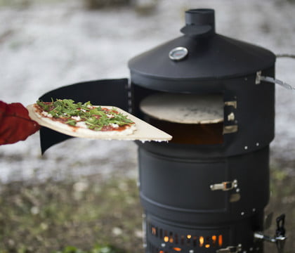 The Aquaforno II is a portable grill, oven, rotisserie, and smoker all-in-one