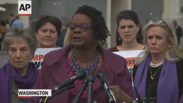 House approves domestic violence law amid dispute over guns