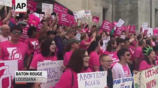 Louisiana's Democratic governor signs abortion ban into law